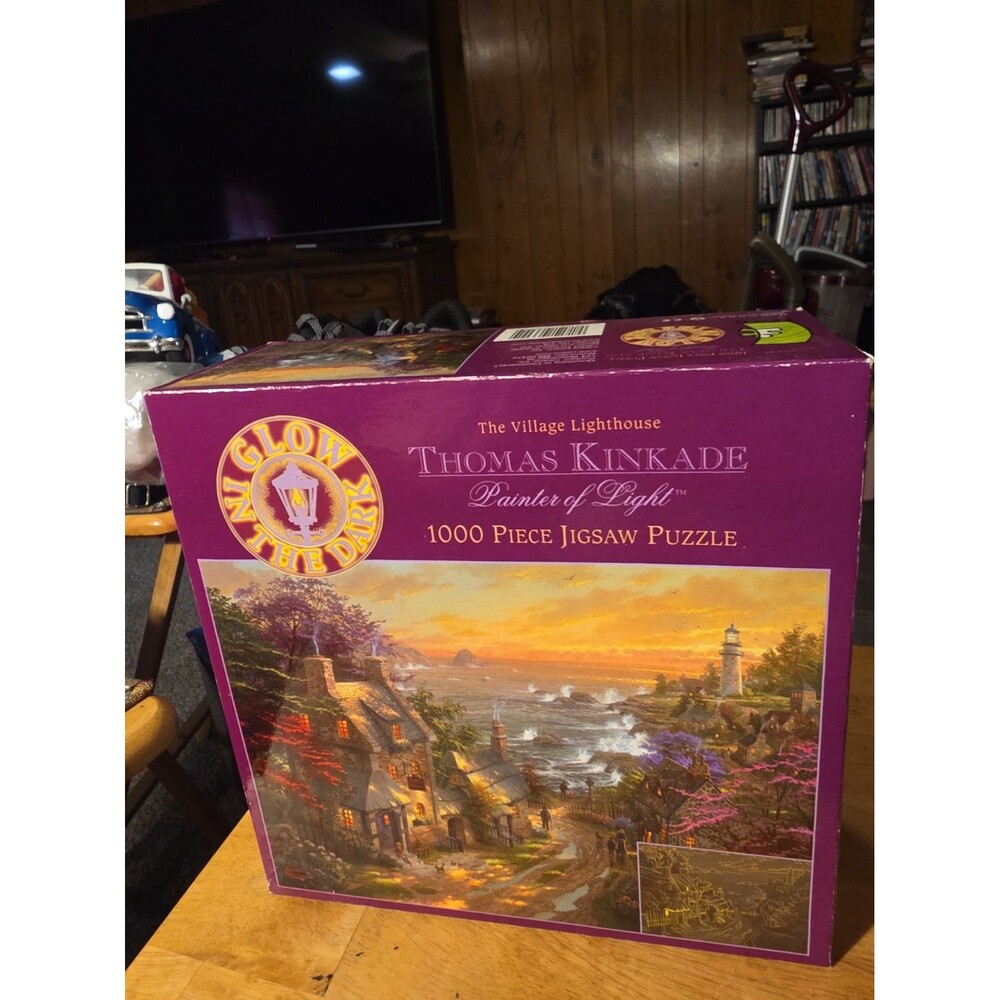 Thomas Kinkade Glow in The Dark 1000 Piece Puzzle Called The Village Lighthouse